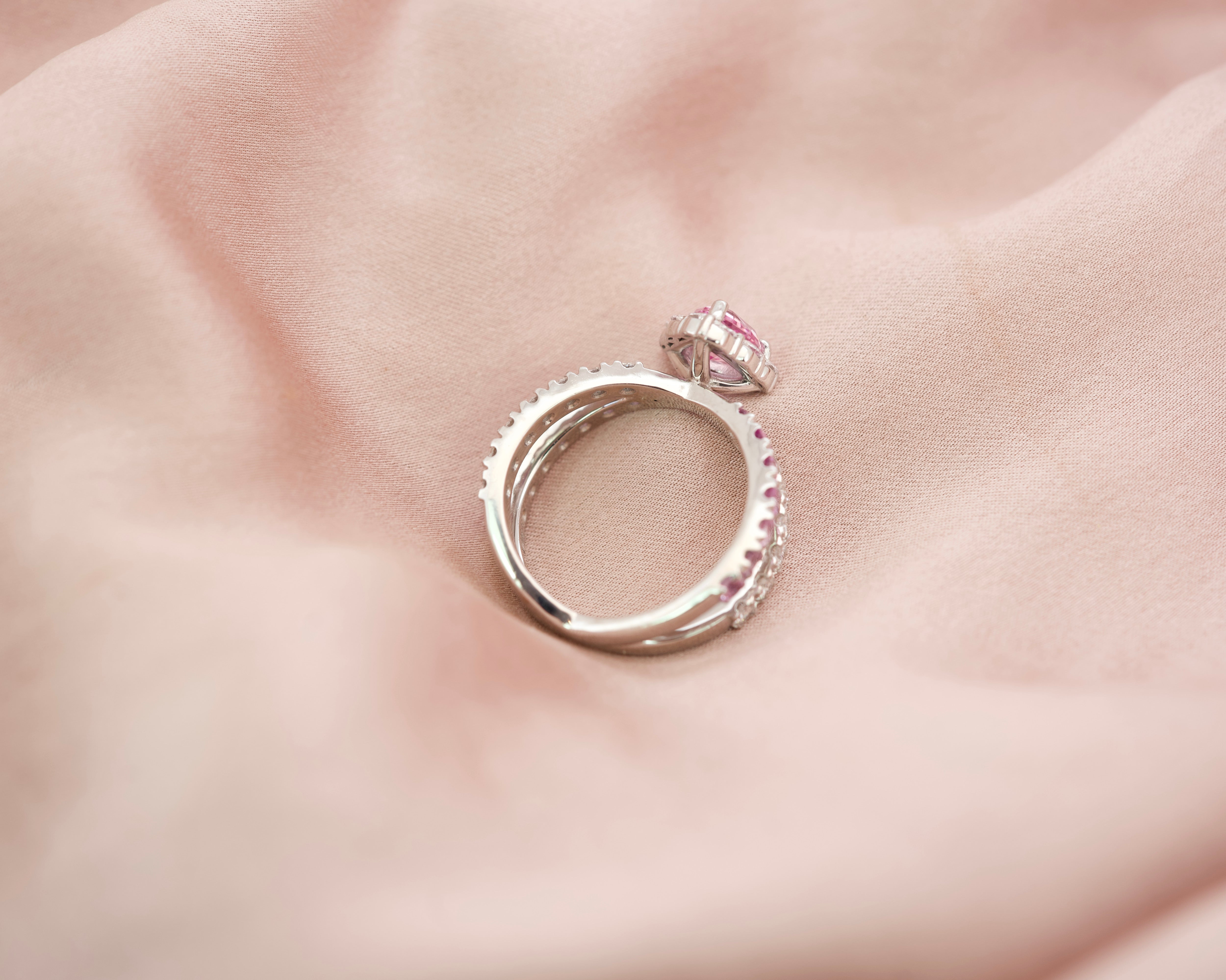 Underside view of the Platinum 950 setting for a pink sapphire criss-cross ring