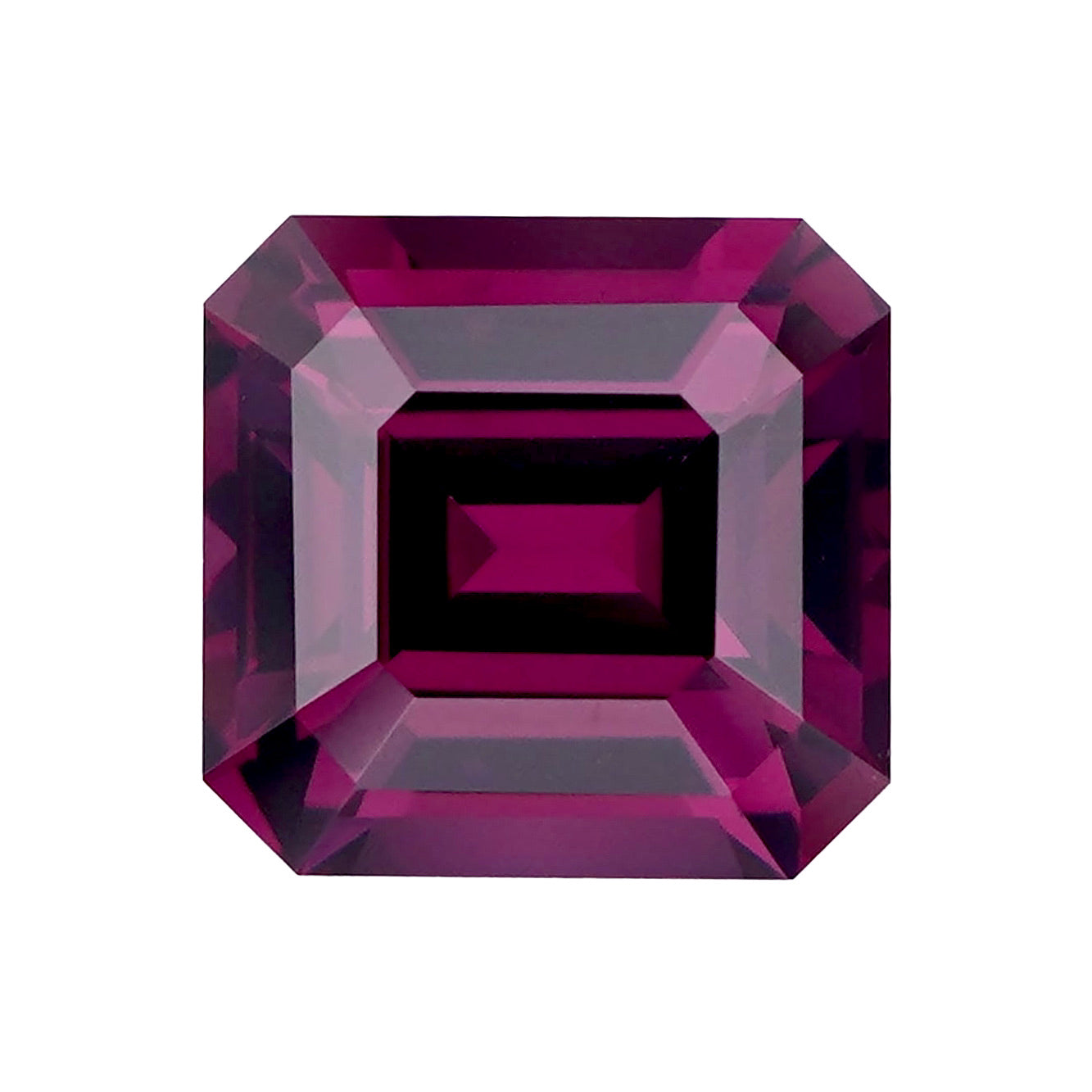 Unmounted pinkish purple emerald cut rhodolite garnet.