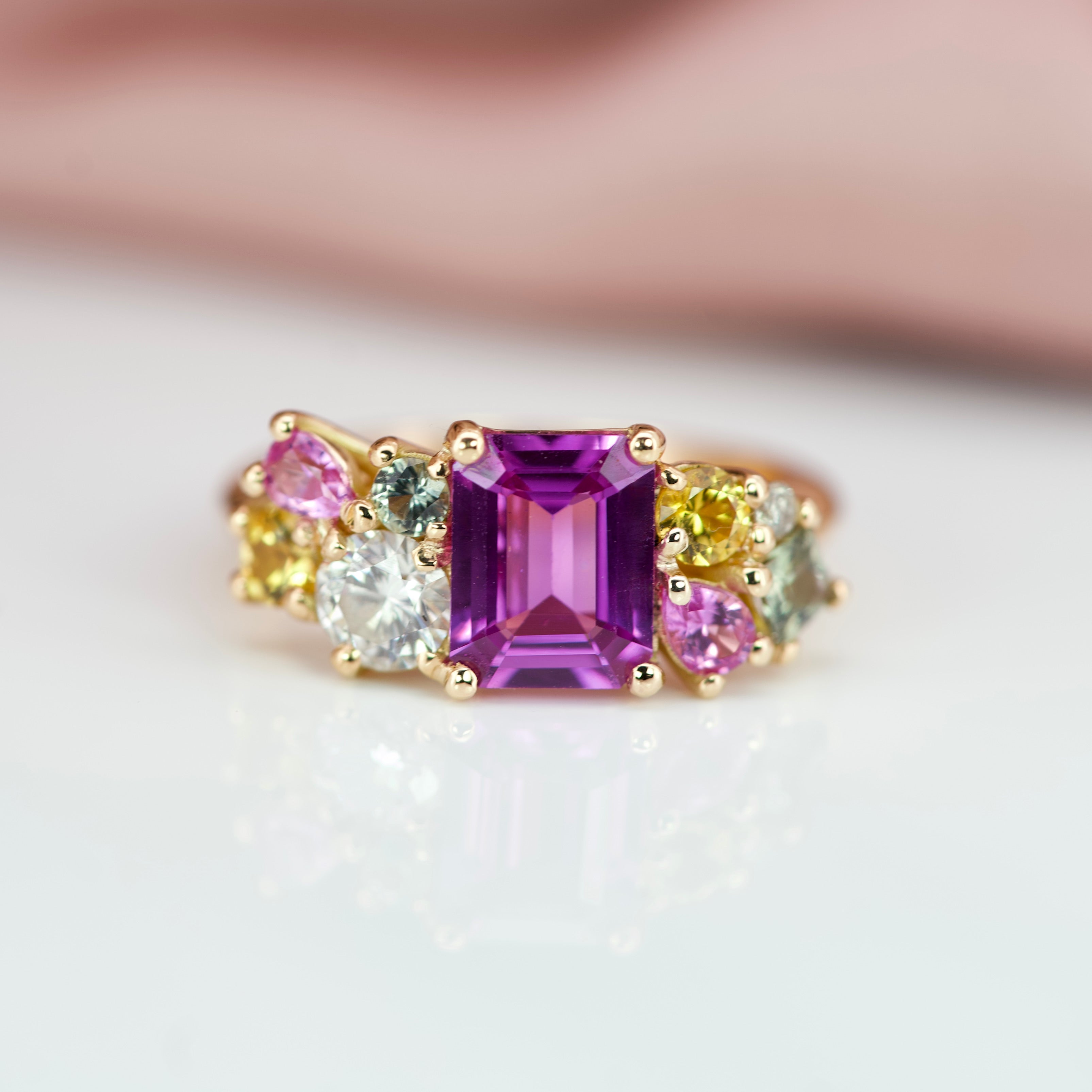 custom engagement ring design with a cluster of sapphires 
