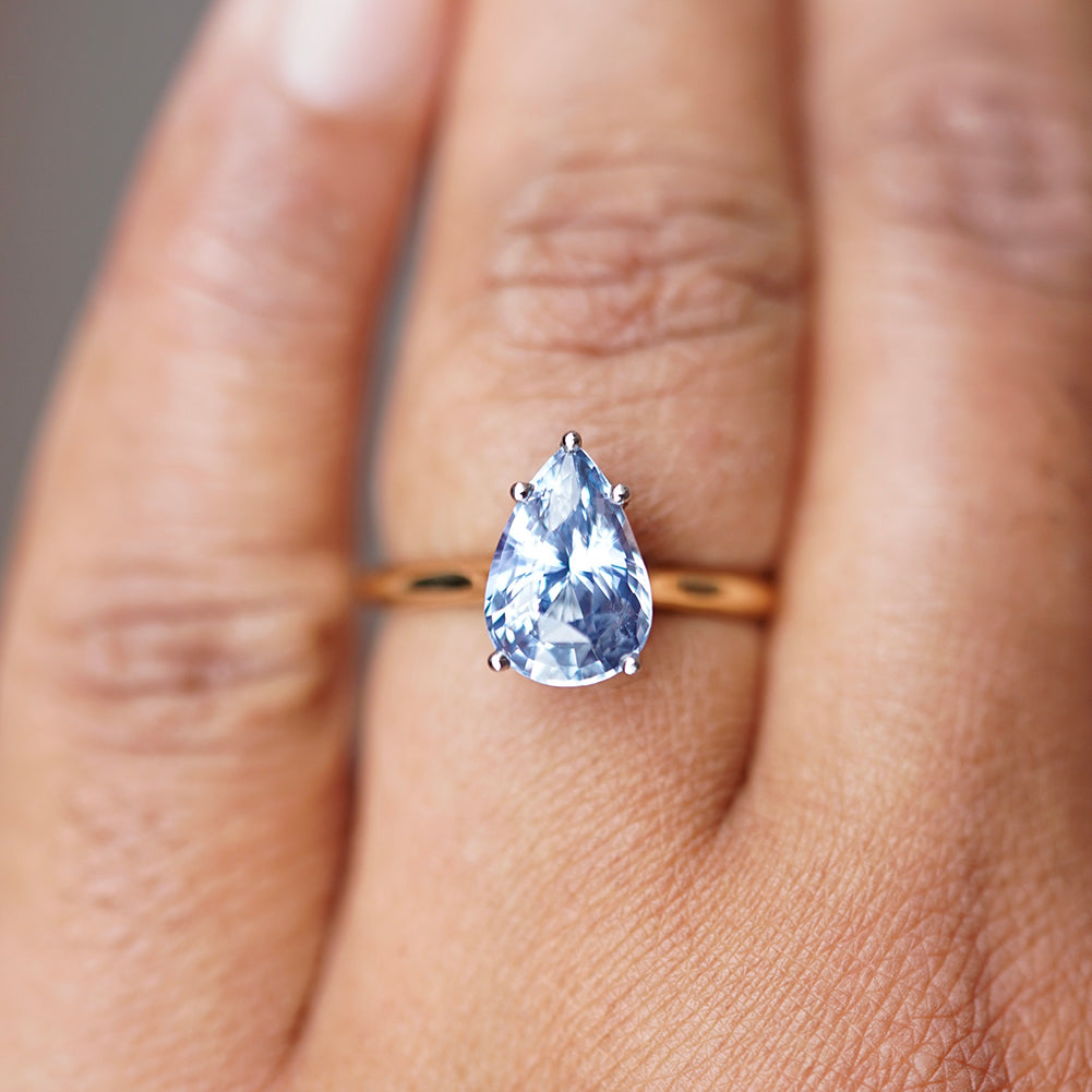 custom ceylon pear blue sapphire ring in white and yellow gold