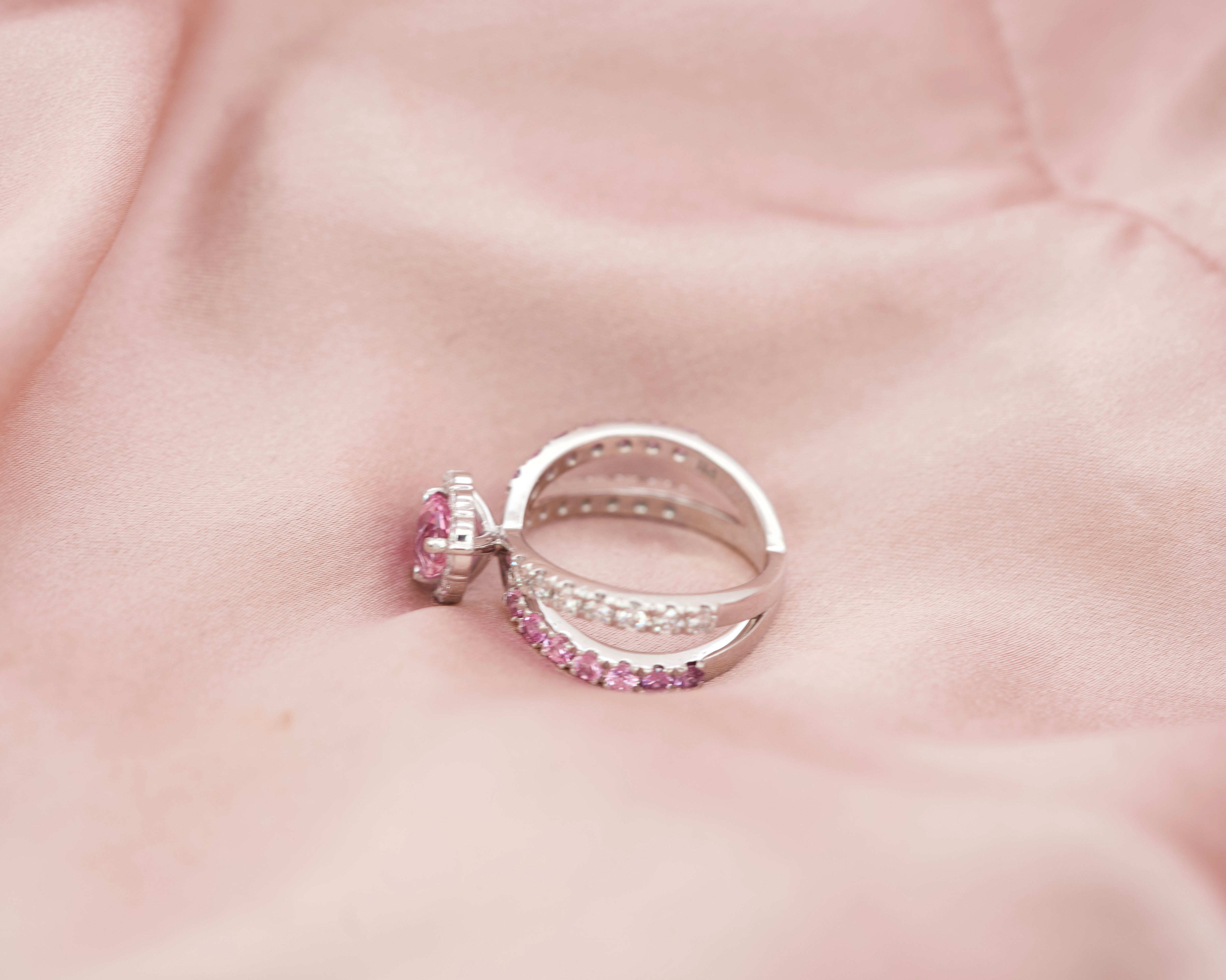 Side profile of a pink sapphire ring illustrating the intricate criss-cross split band design