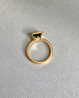 Bluish green sapphire bezel ring, flat lay view