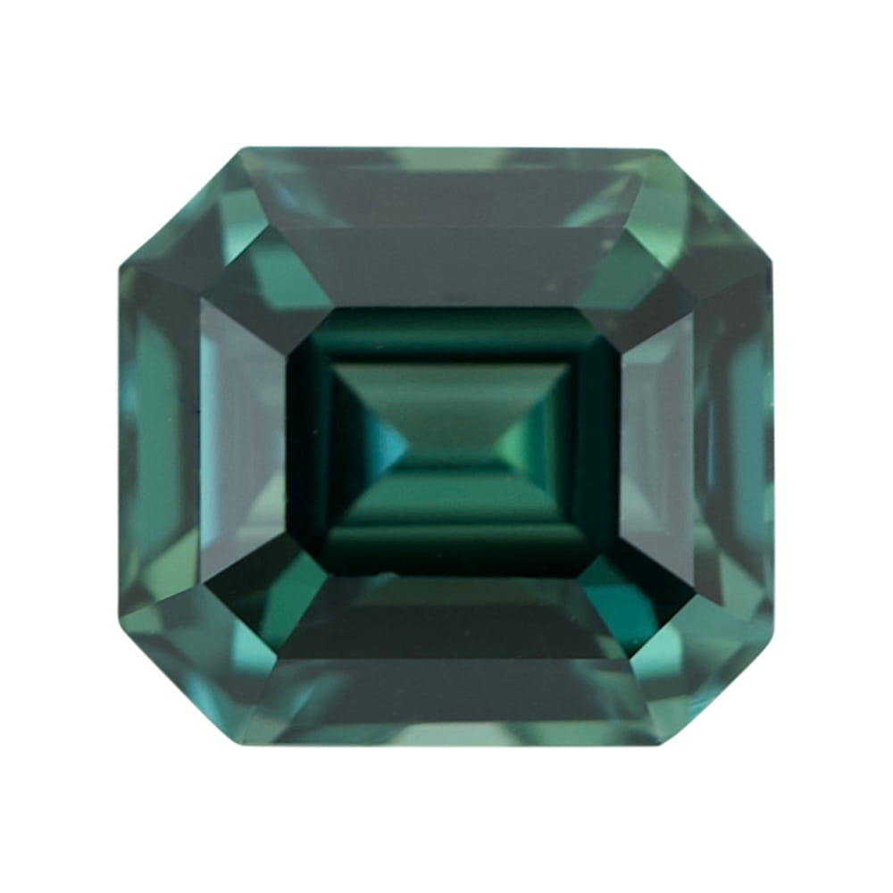 Natural unheated rectangular step-cut green sapphire with truncated corners.