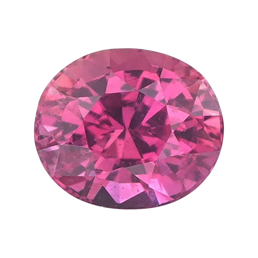 Hot pink oval mixed-cut loose sapphire isolated on white.