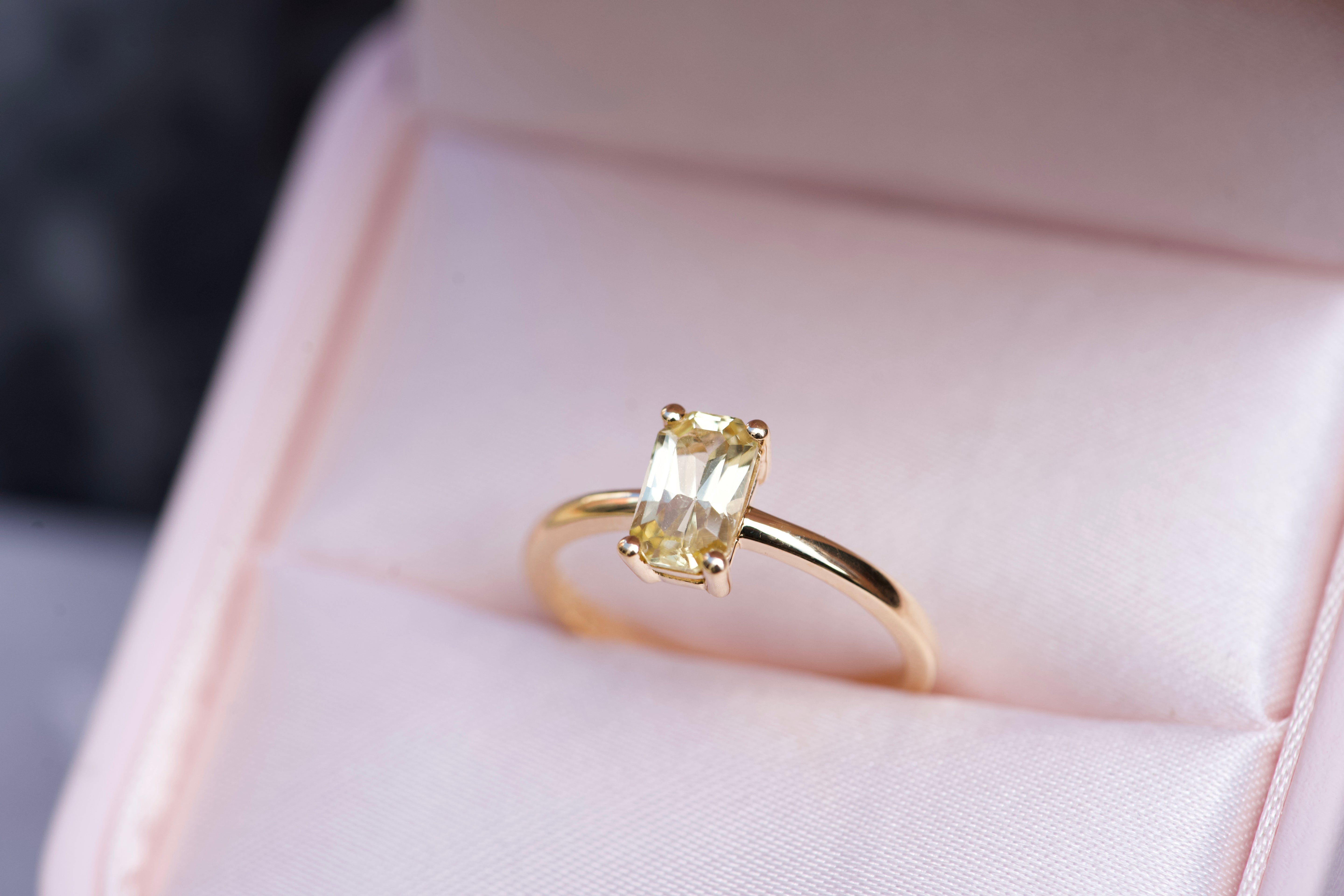 Emerald cut yellow sapphire ring in yellow gold, in box