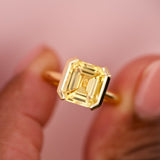 Emerald Cut Yellow Sapphire Half Bezel Set Ring