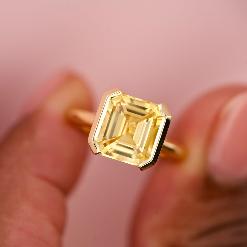 Emerald Cut Yellow Sapphire Half Bezel Set Ring