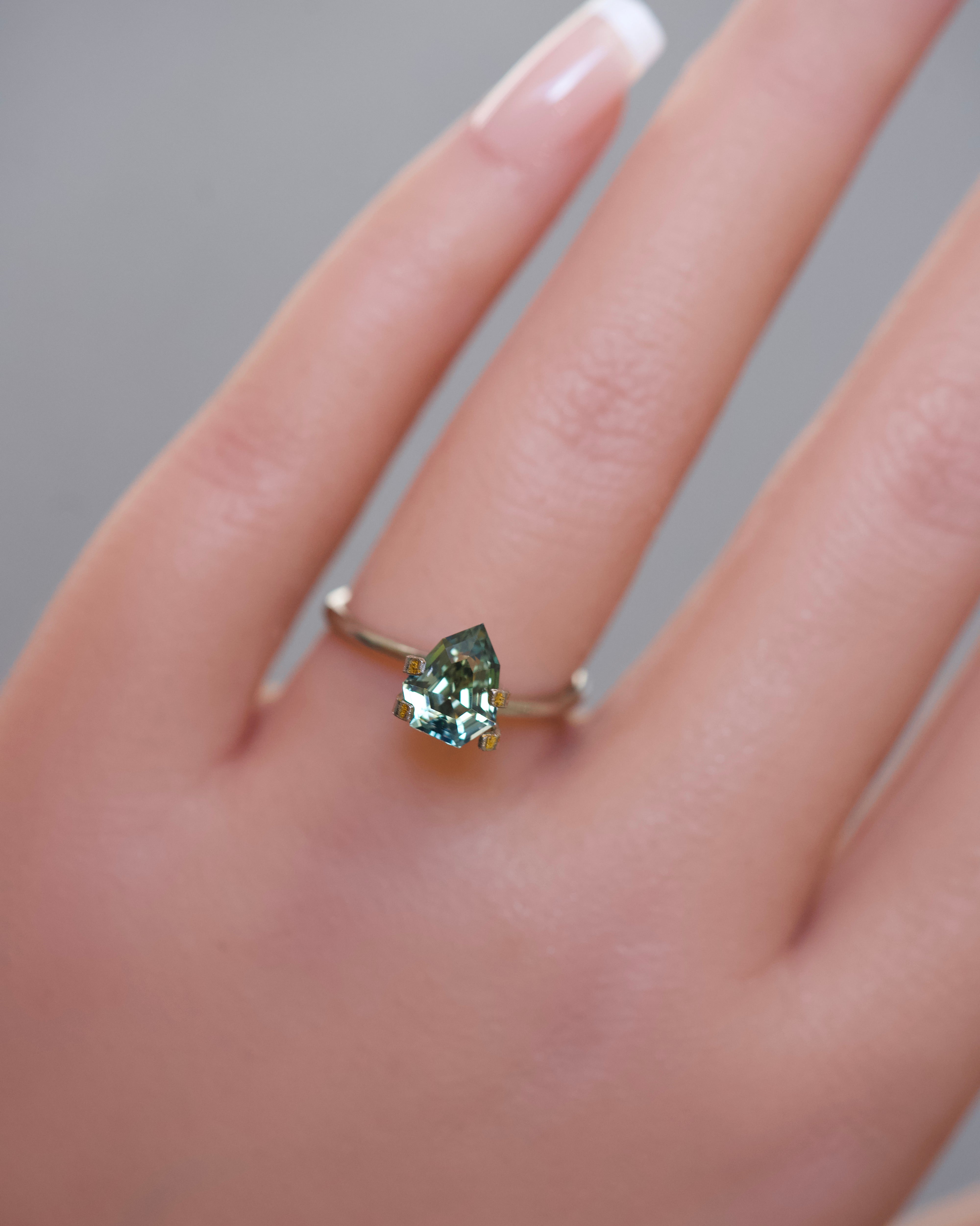 yellowish green 2.10ct unheated step cut sapphire