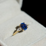 Cornflower Blue Oval Sapphire Trilogy Engagement Ring Yellow Gold