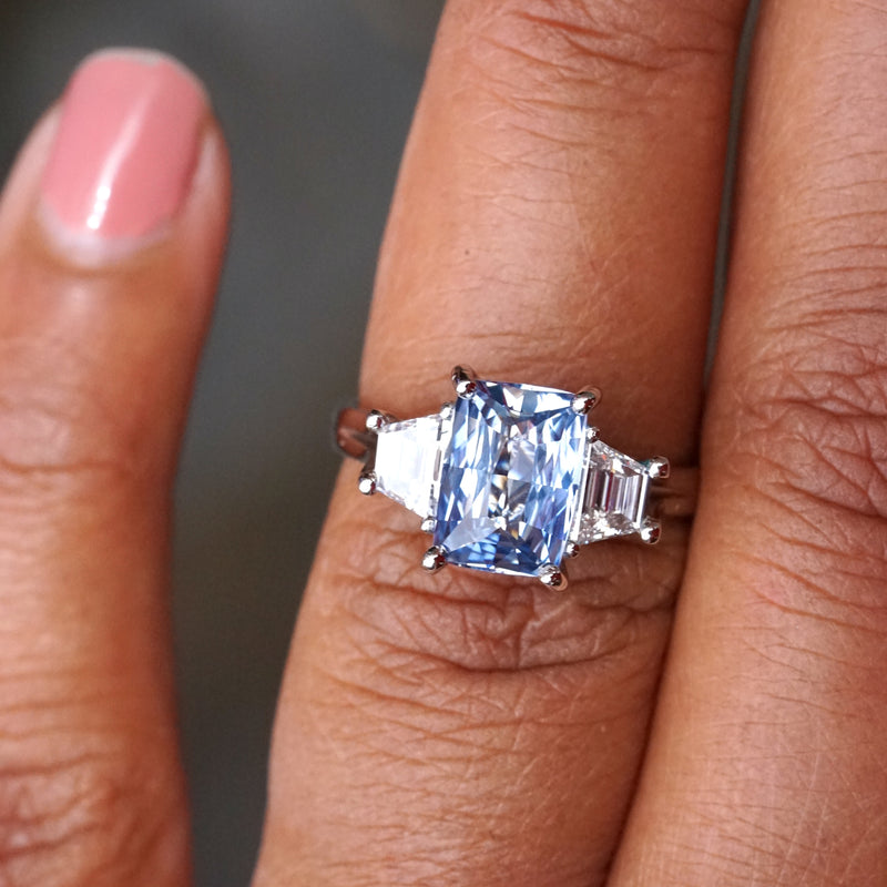 Light Blue Sapphire Trilogy Engagement Ring in Platinum