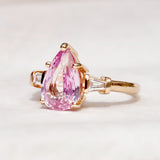 engagement-ring-with-pink-sapphire-tapered baguette diamond-shoulders