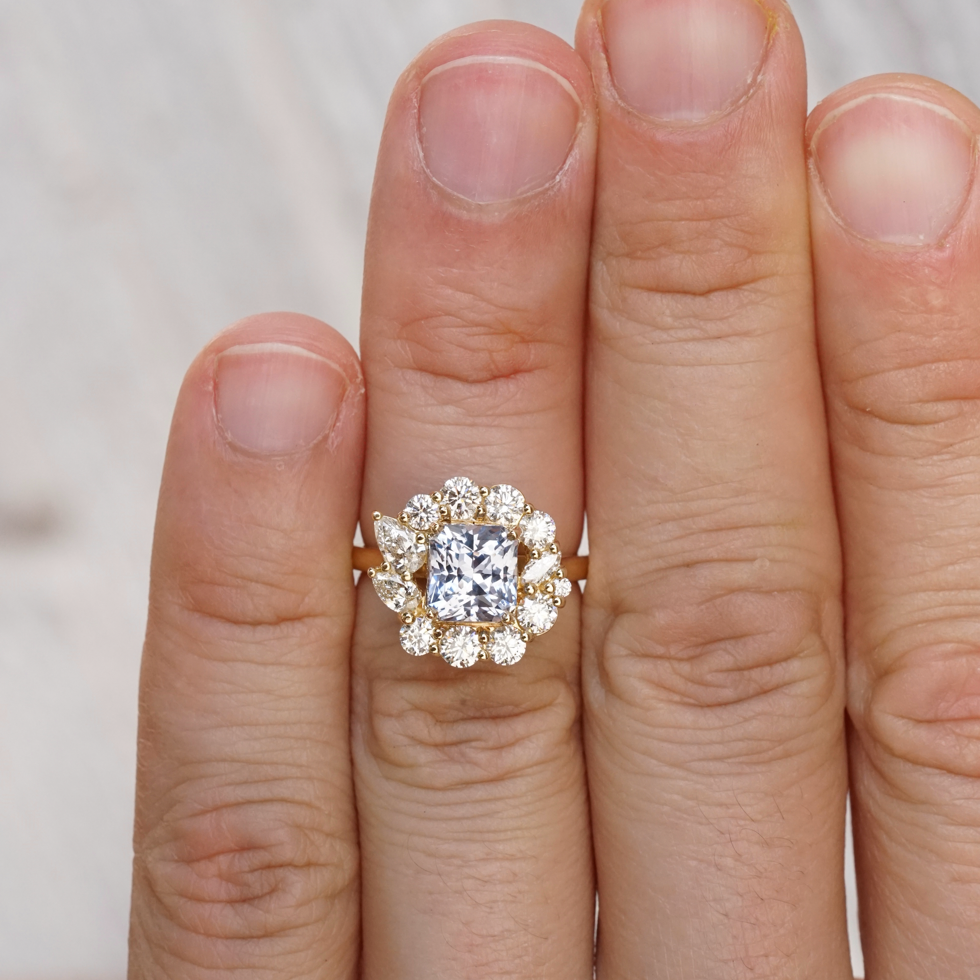 Blue Sapphire and Diamond Cluster Ring in Yellow Gold