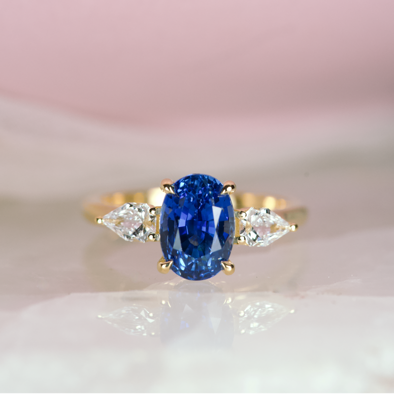 Cornflower Blue Oval Sapphire Trilogy Engagement Ring Yellow Gold