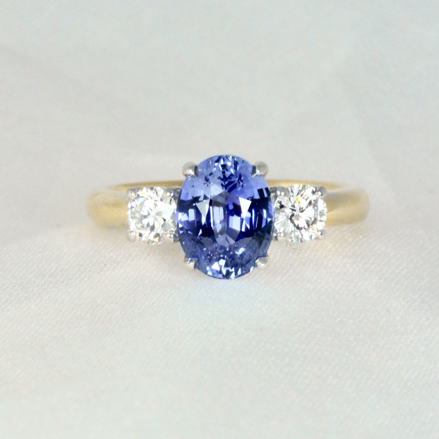 Cornflower Blue Sapphire Oval Trilogy Engagement Ring Two Tone